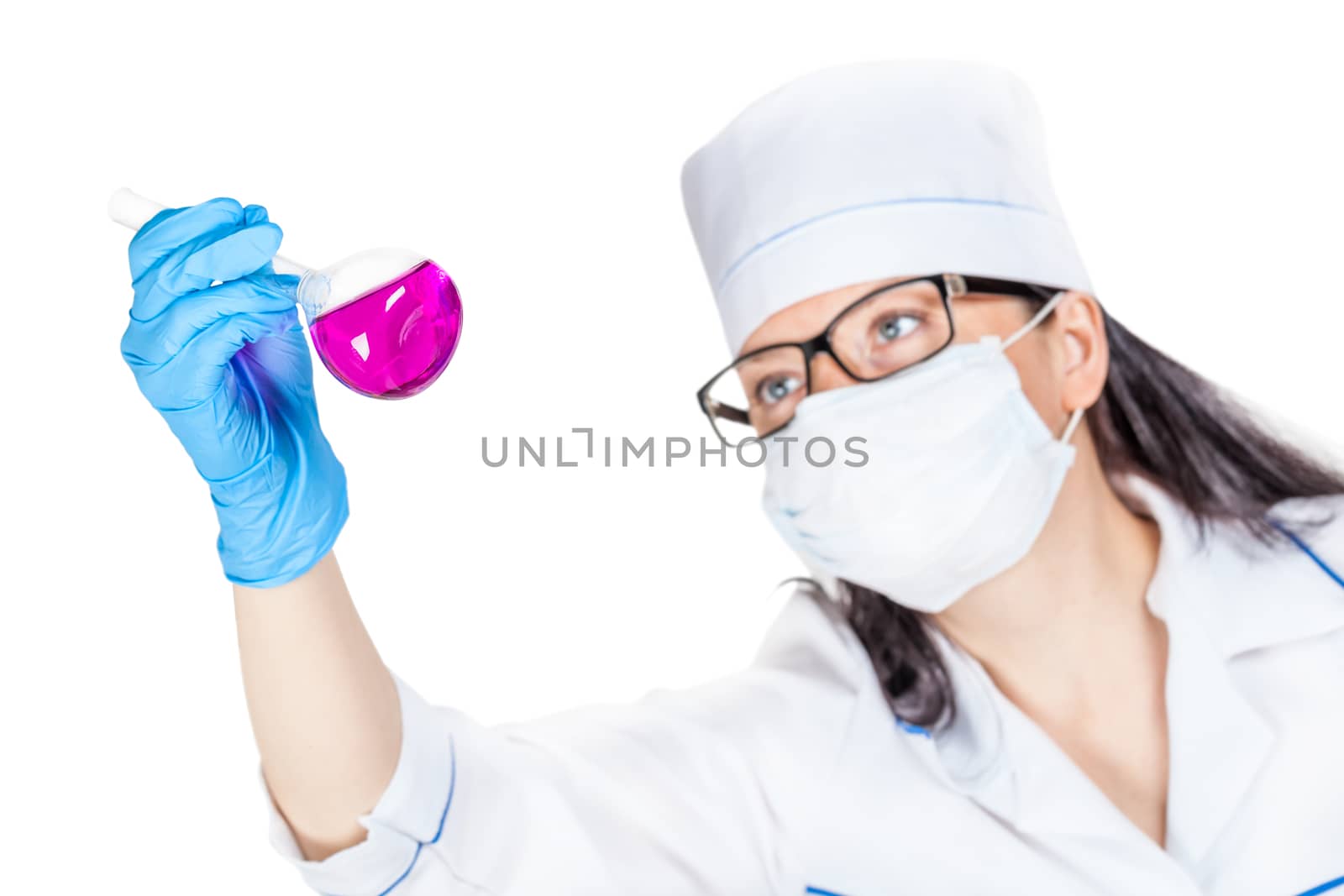 laboratorian inspects the contents of the flask on a light background