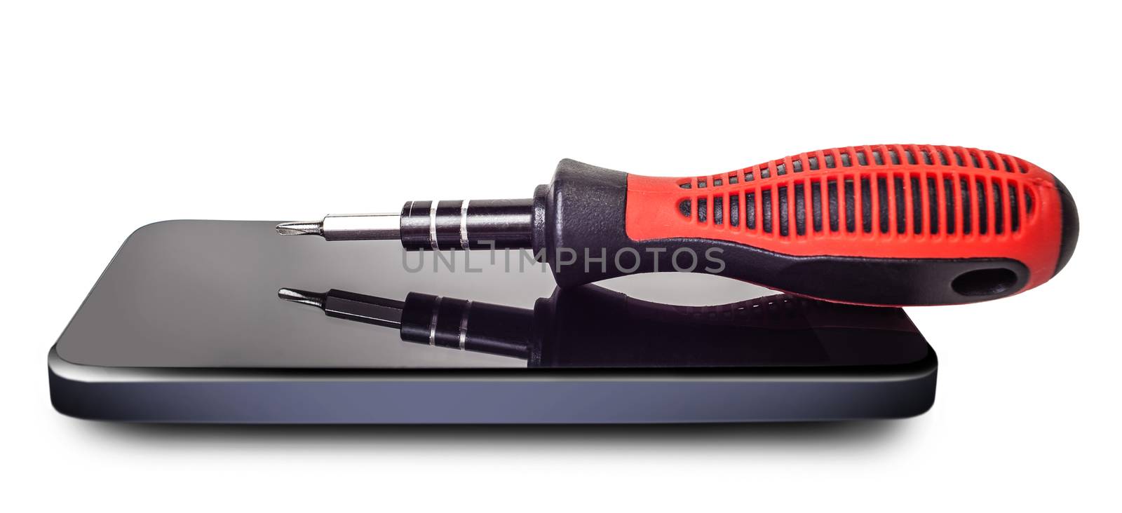 screwdriver lying on the phone on white isolated background