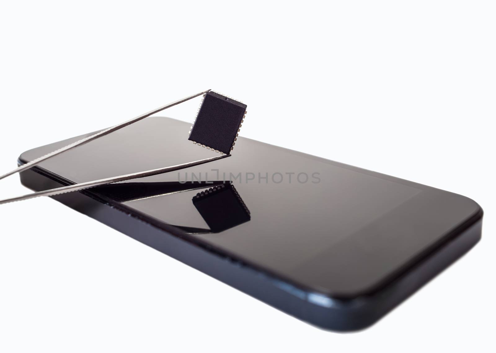 tweezers with detail and phone on white isolated background
