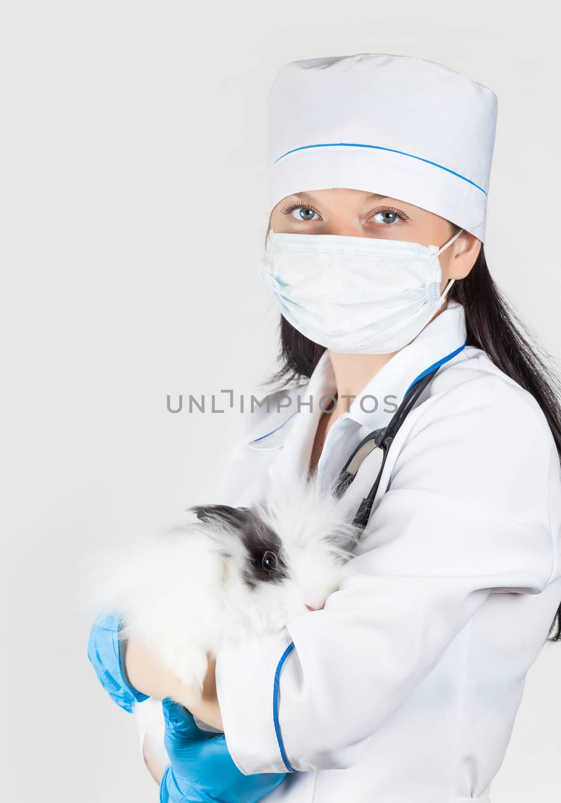 portrait of a doctor with rabbit in hands