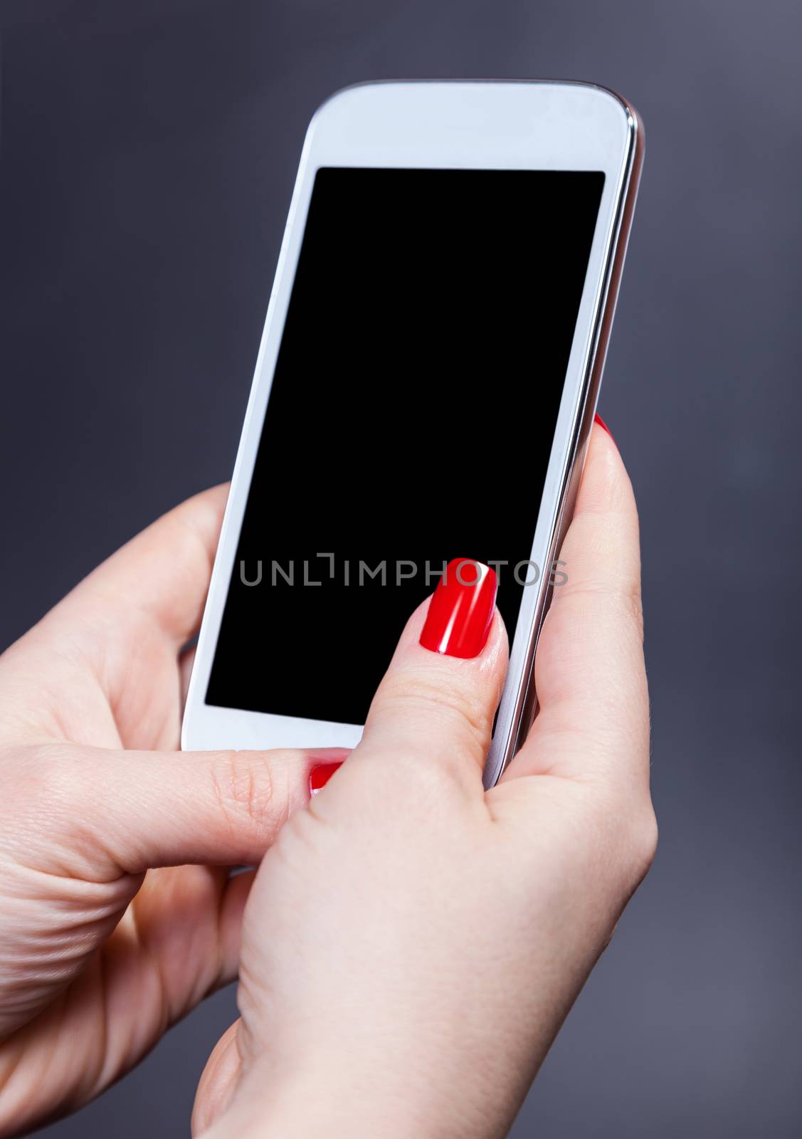 white smartphone in female hands, communication background