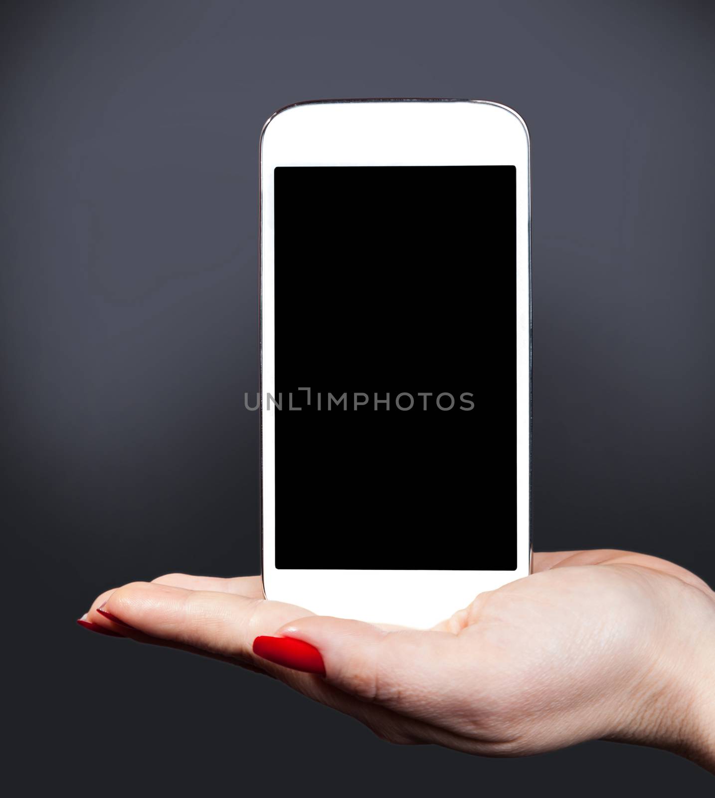 white smartphone on a female hand by MegaArt