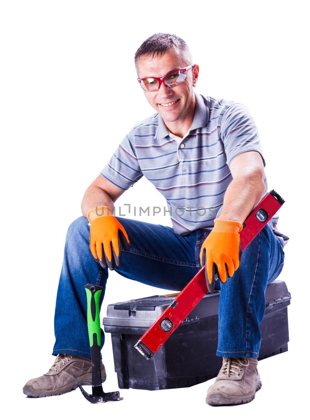 the working sitting on a box with tools isolated white background
