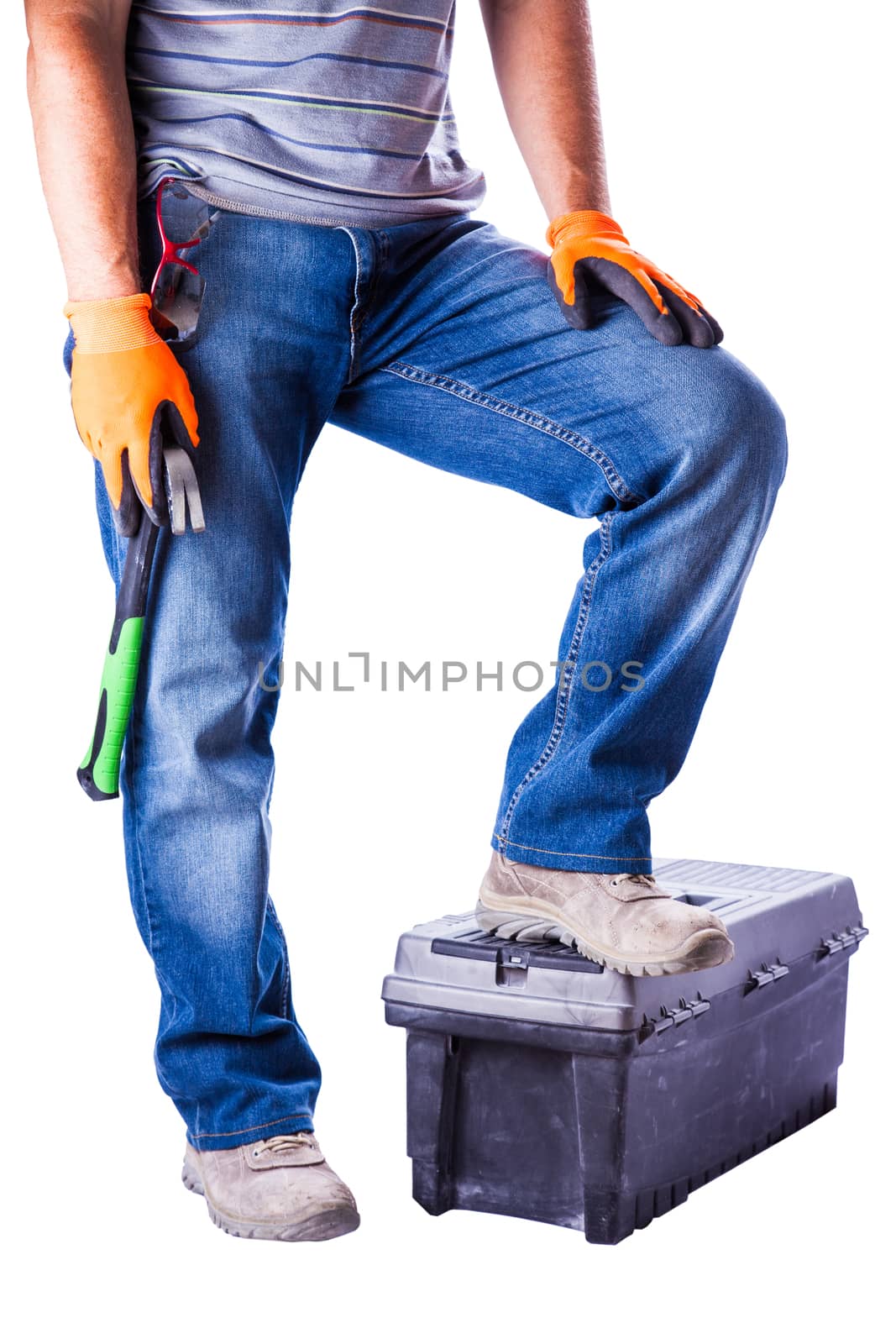 man put his foot on the toolbox isolated white background