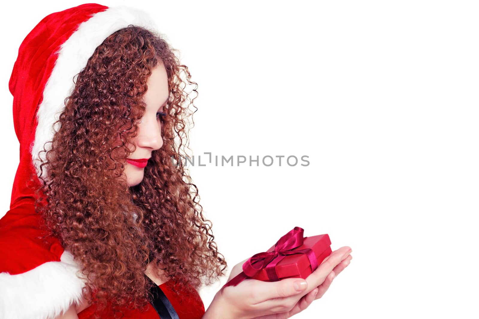 pretty curly girl as Santa with Christmas presents isolated