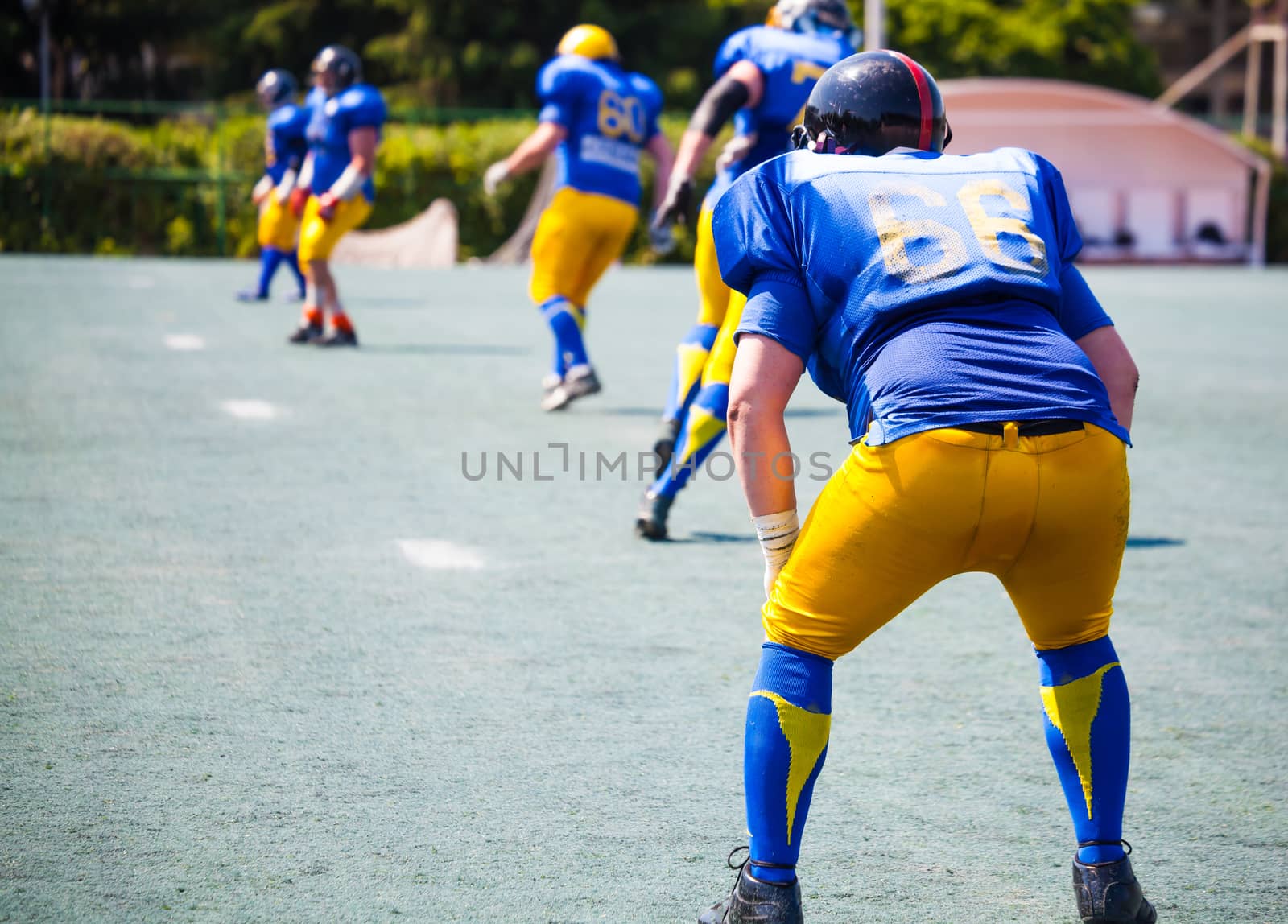 athletes from one team lined up for attack