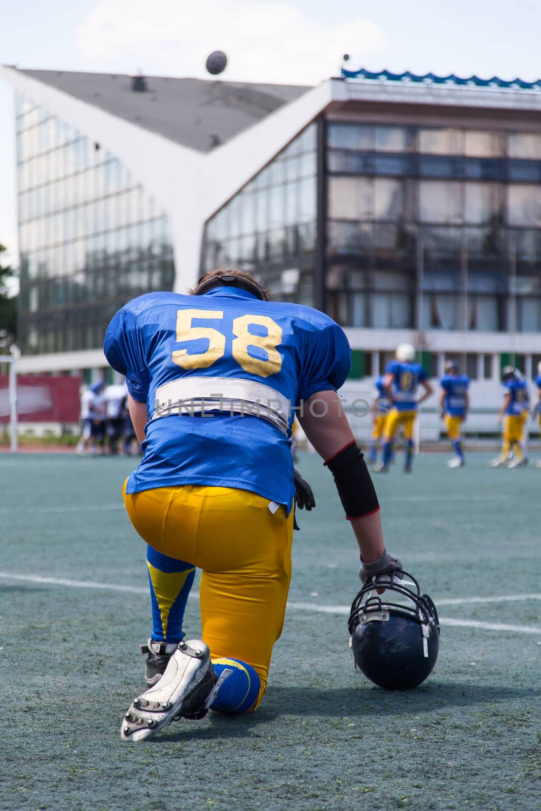 American football player resting during a match