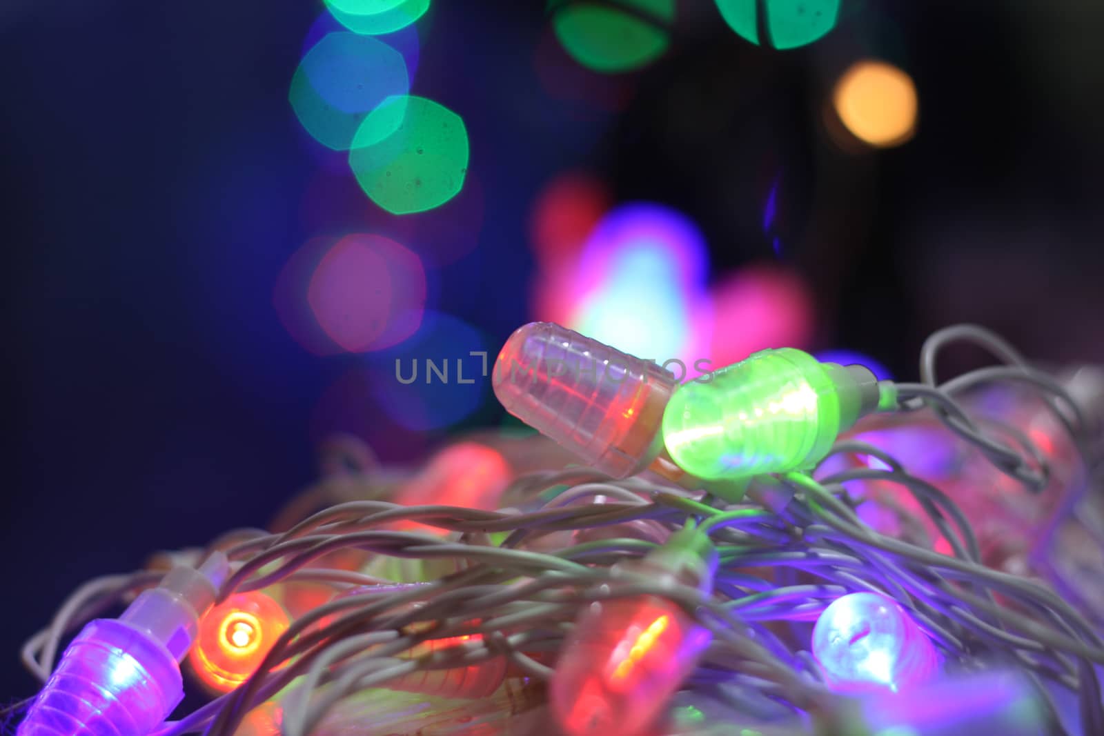 A line of colorful decorative bulbs lit on the occasion of Diwali / Christmas in India