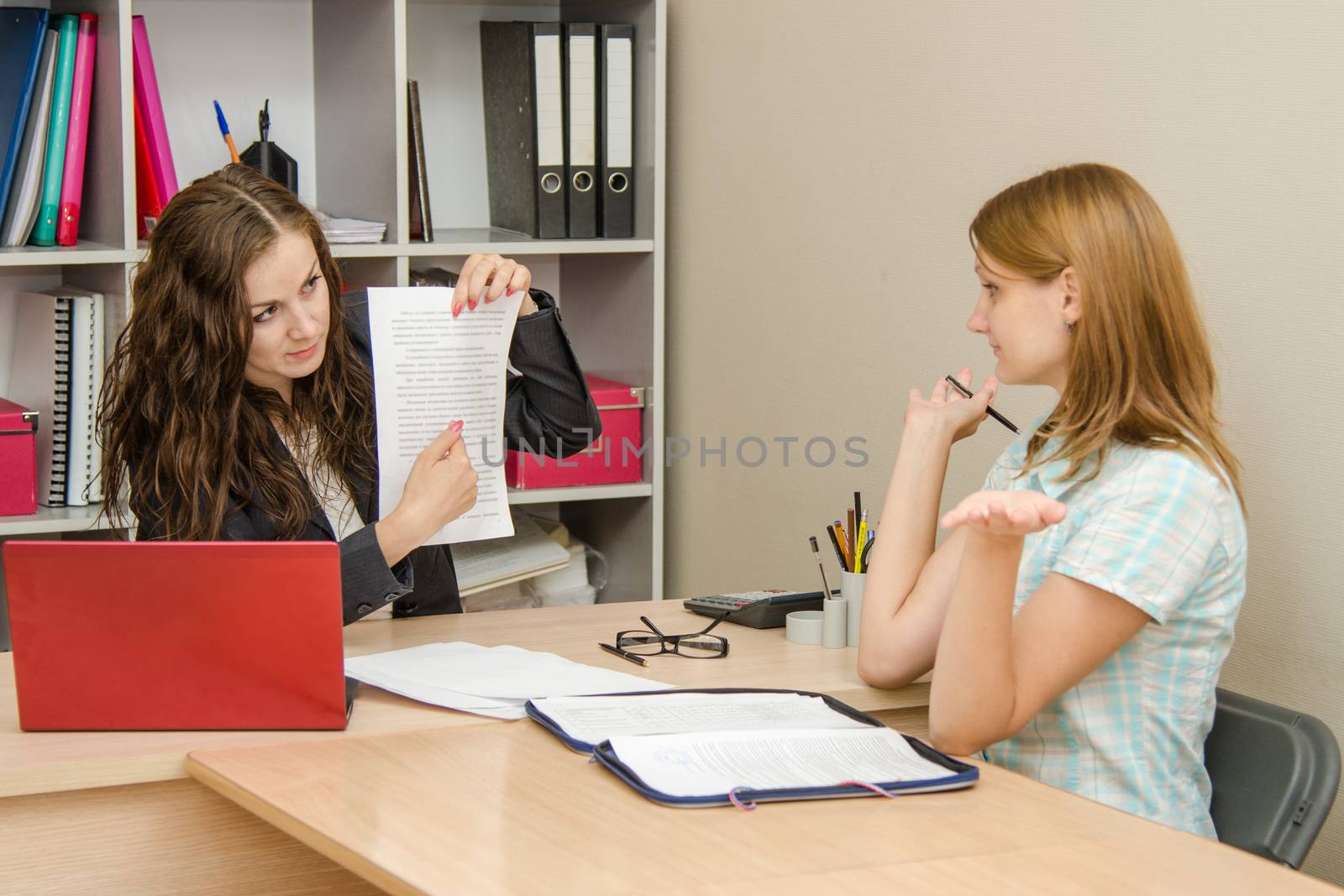 Young beautiful girl on reception at the office specialist