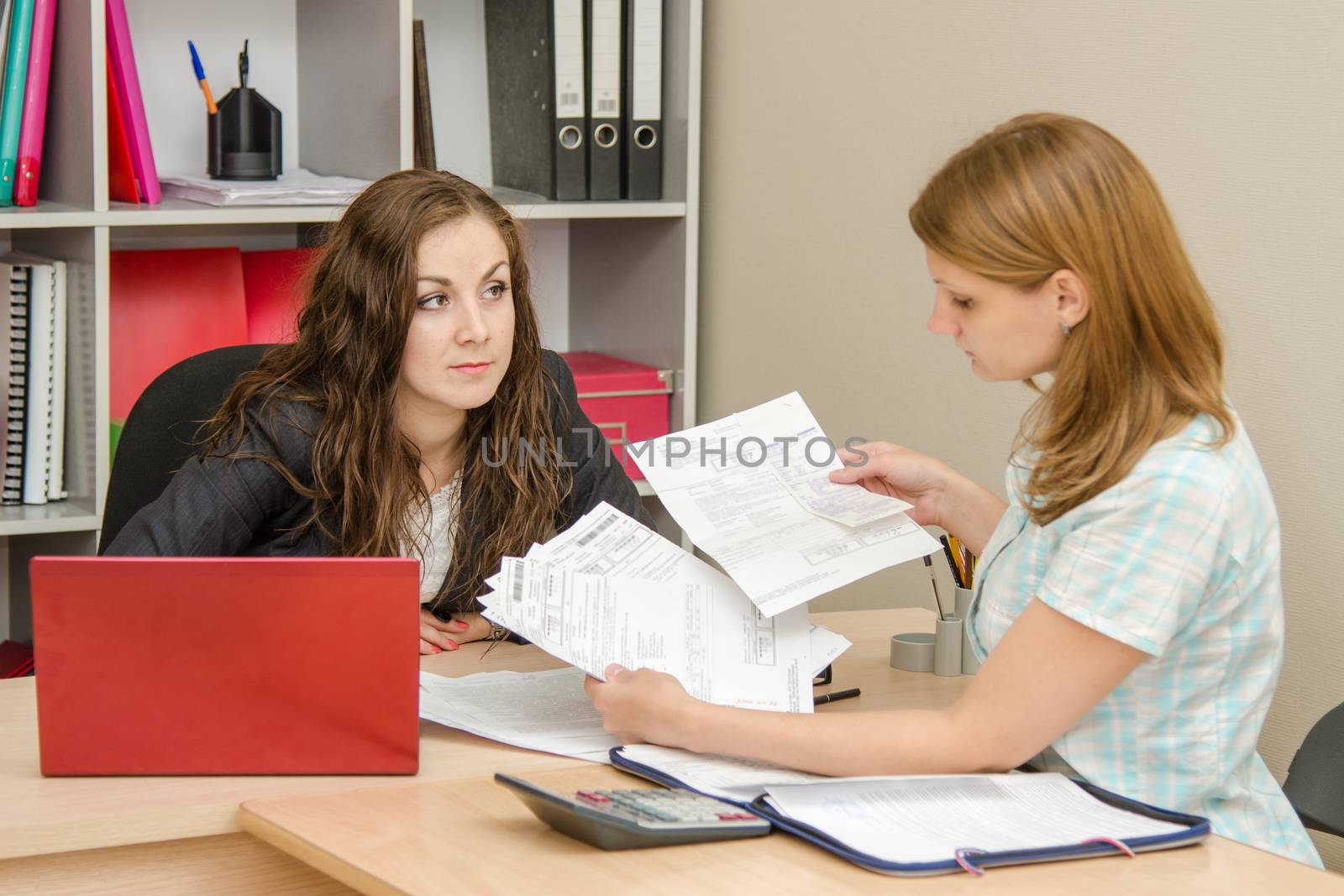 Young beautiful girl on reception at the office specialist
