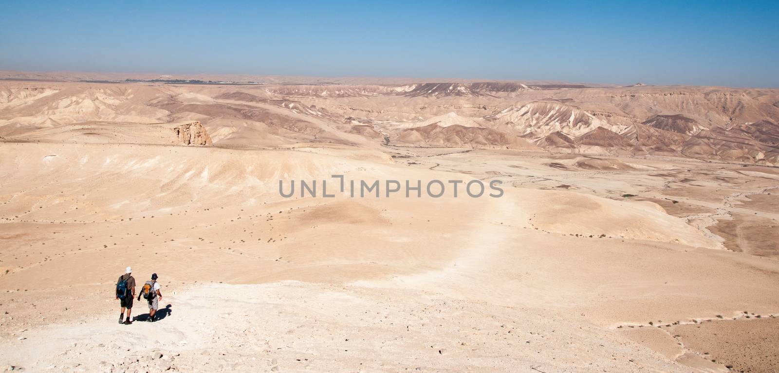 Tourist travel in negev desert of stones and mountains