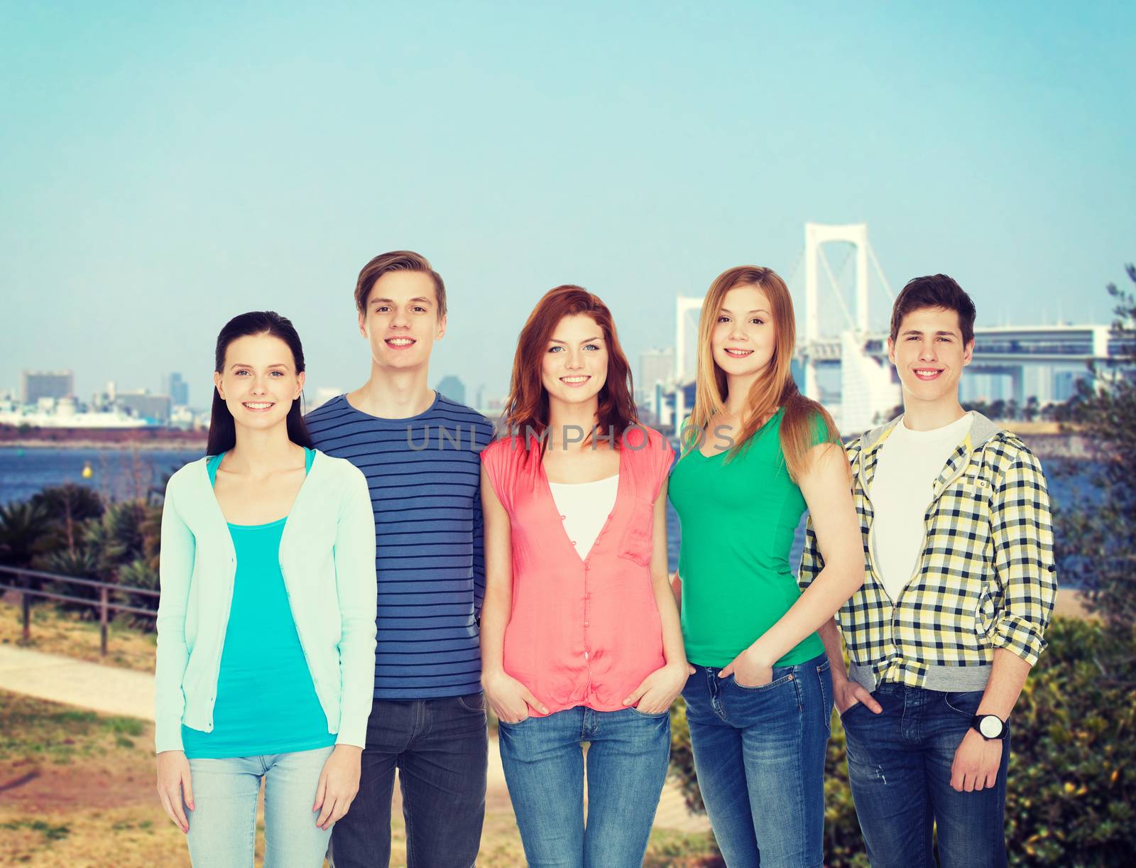 education and people concept - group of smiling students standing