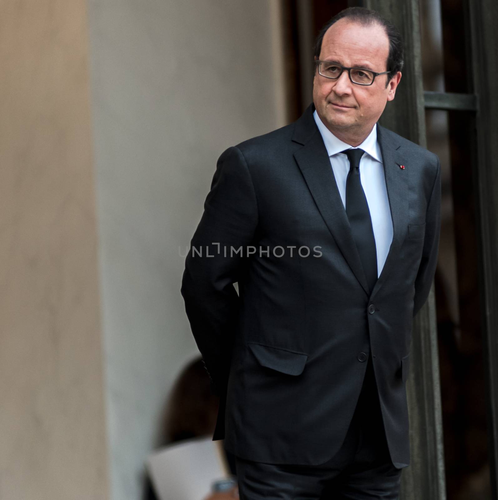 FRANCE, Paris: French President Francois Hollande waits for German Chancellor Angela Merkel and President of European Commission Jean-Claude Juncker at the Elysee palace, in Paris, where takes place a France-Germany digital summit, on October 27, 2015.