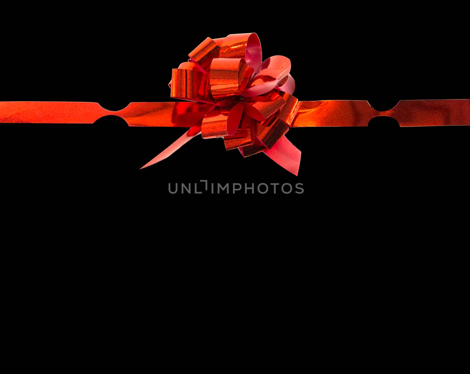 red gift ribbon bow isolated on black