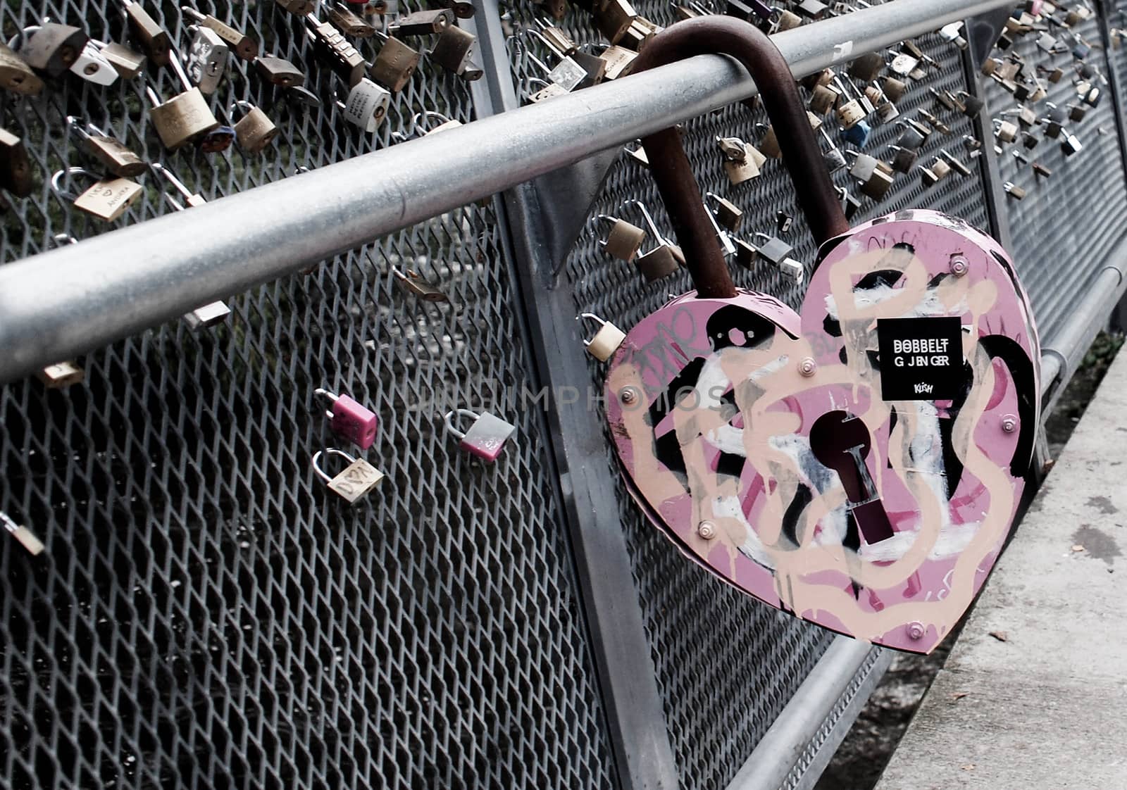 Heart-shaped lock on a bridge