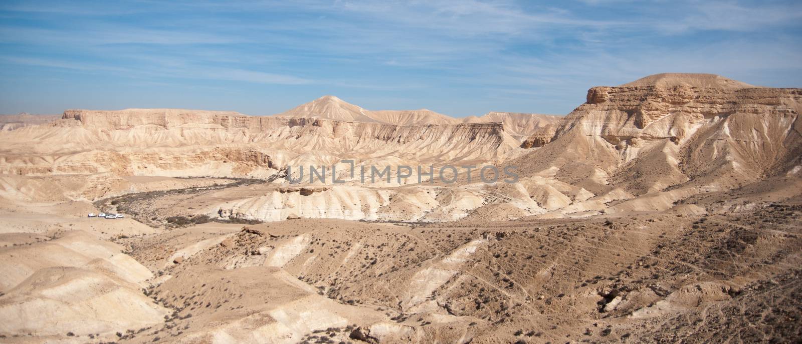 Stone desert tourism hiking in mountains under blue sky