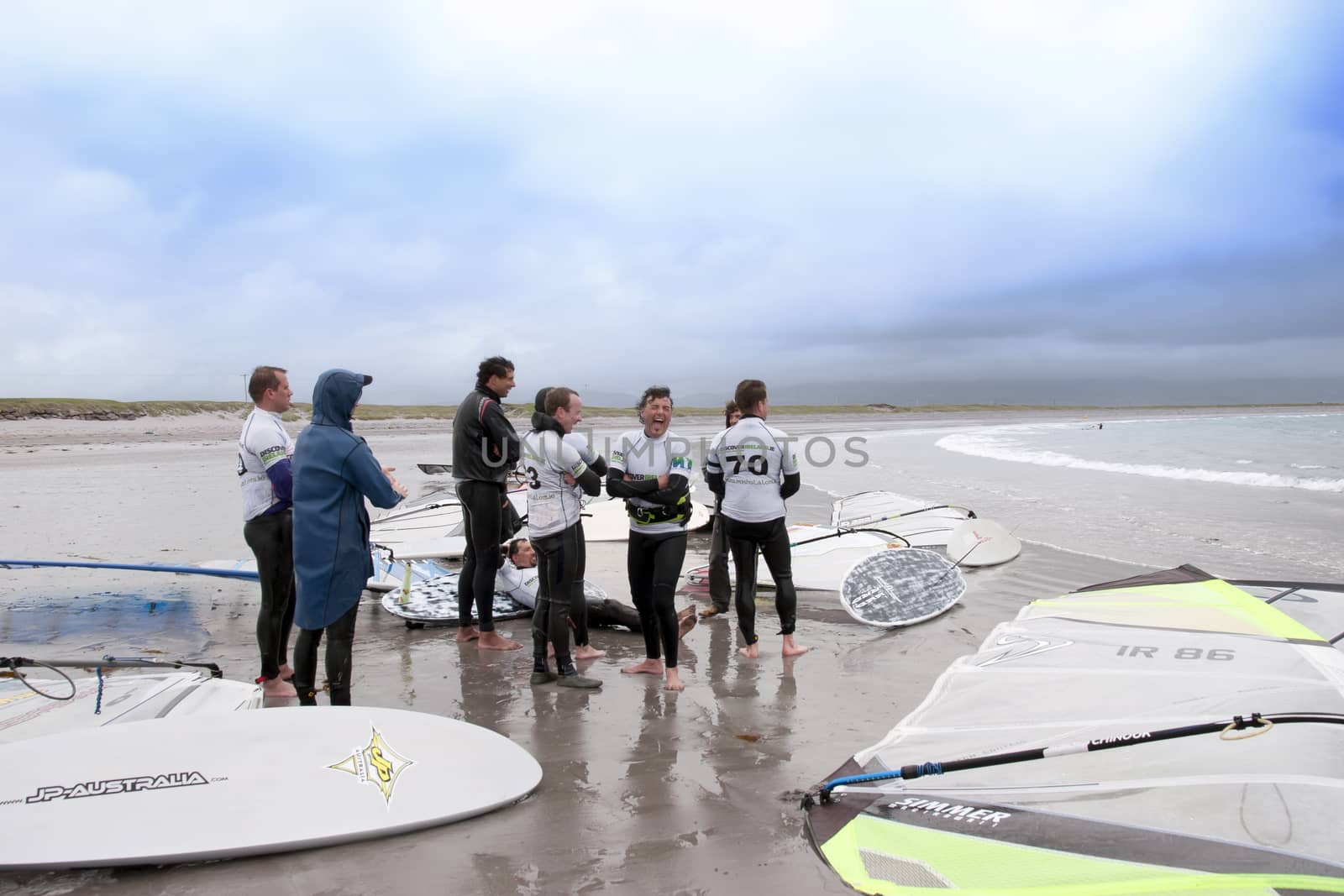 windsurfers having a break on the beach by morrbyte