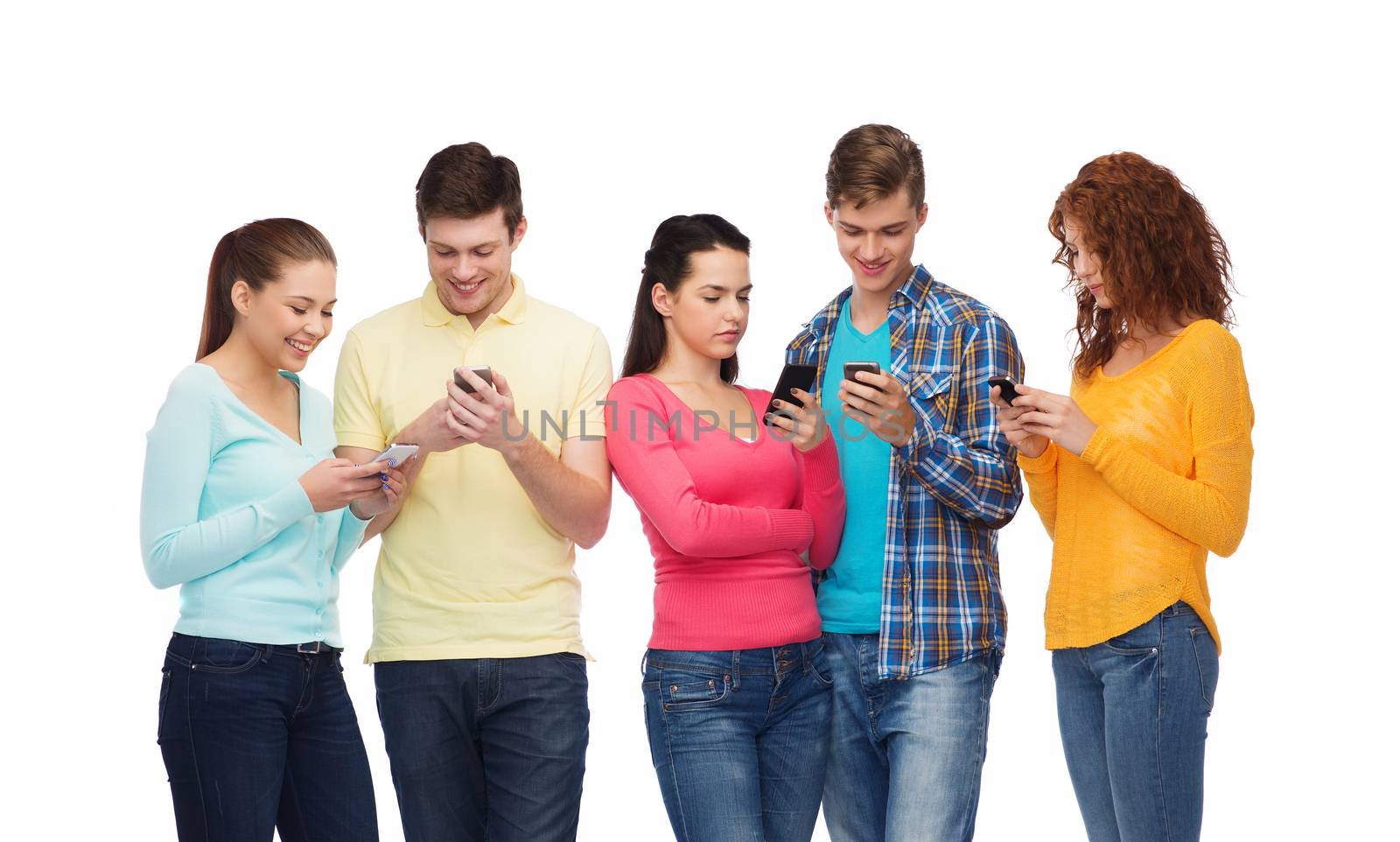 group of smiling teenagers with smartphones by dolgachov