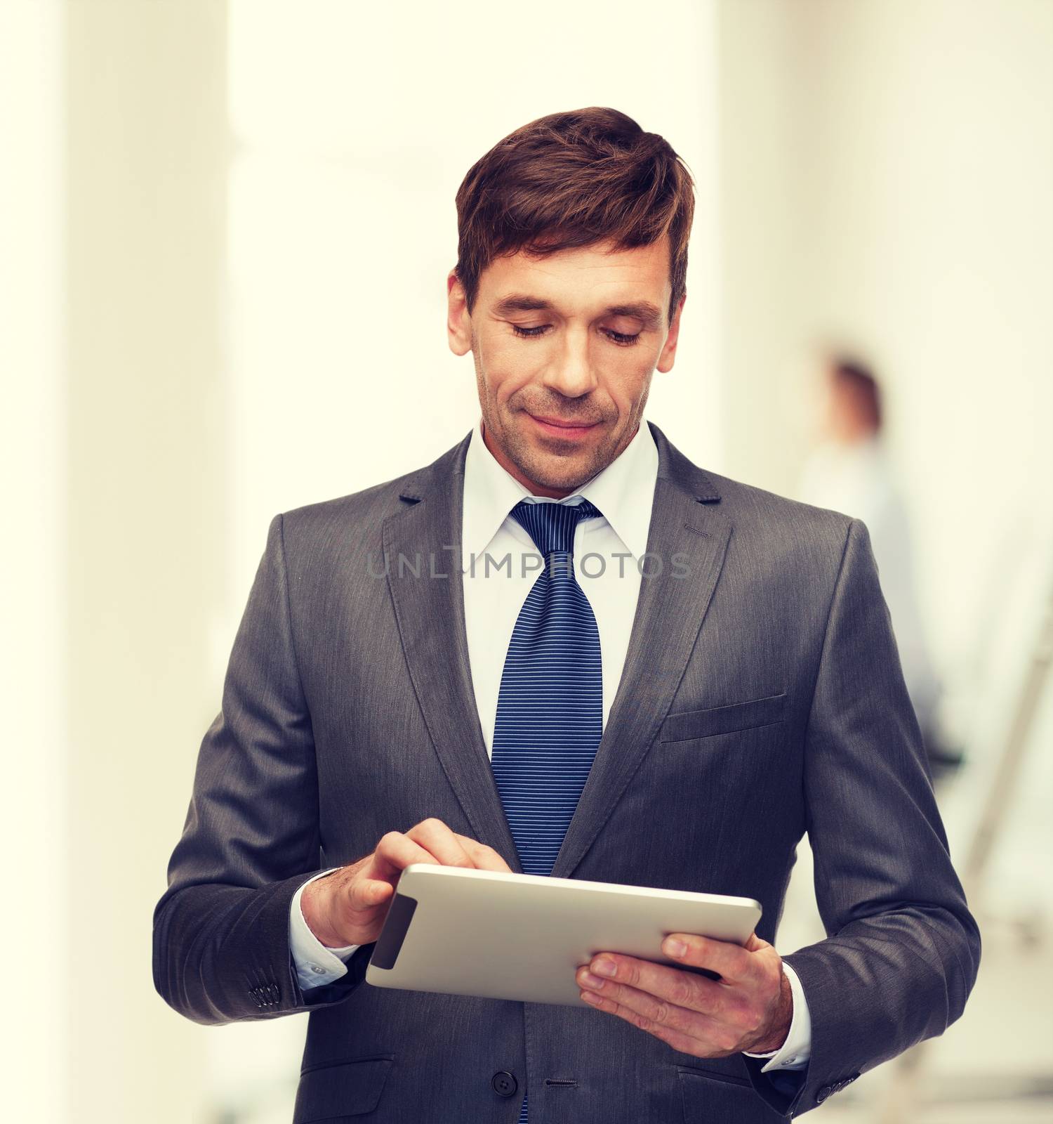 business, communication, modern technology and office concept - buisnessman with tablet pc