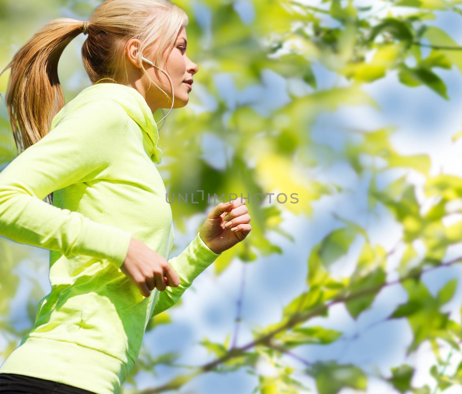 woman jogging outdoors by dolgachov