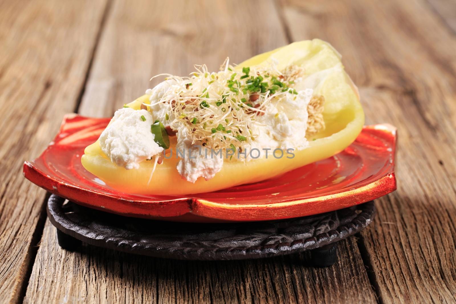 Pepper with curd cheese and lentil sprouts