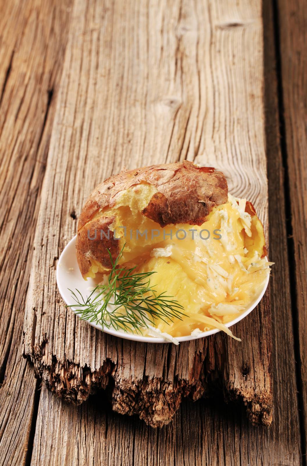 Baked potato with two kinds of cheese