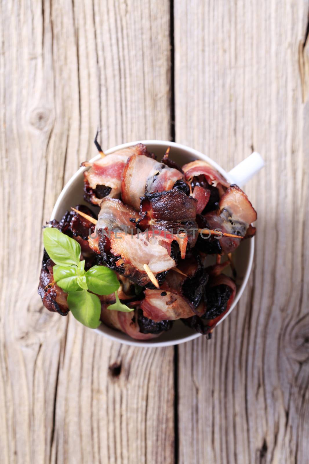 Bowl of delicious bacon-wrapped prunes - overhead