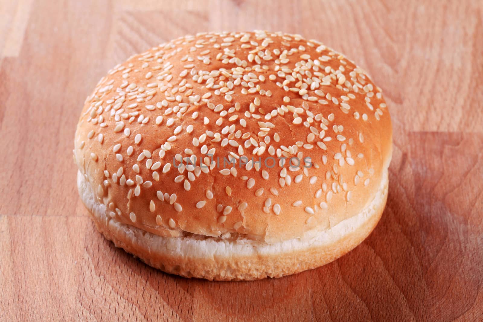 Hamburger bun with sesame seeds on top