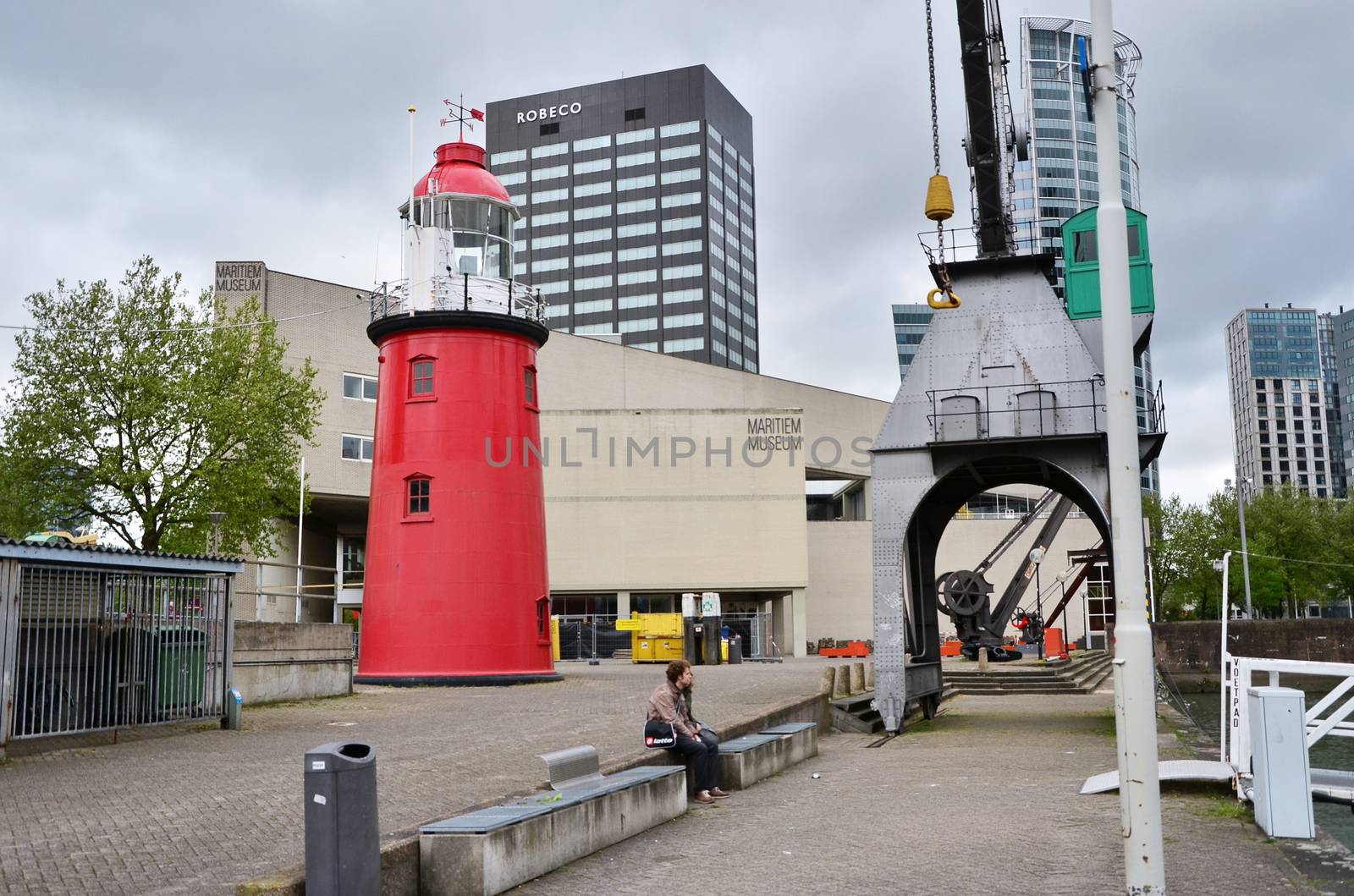 Rotterdam, Netherlands - May 9, 2015: People around maritime museum in Rotterdam, the Netherlands. Dedicated to naval history, it was founded in 1873.