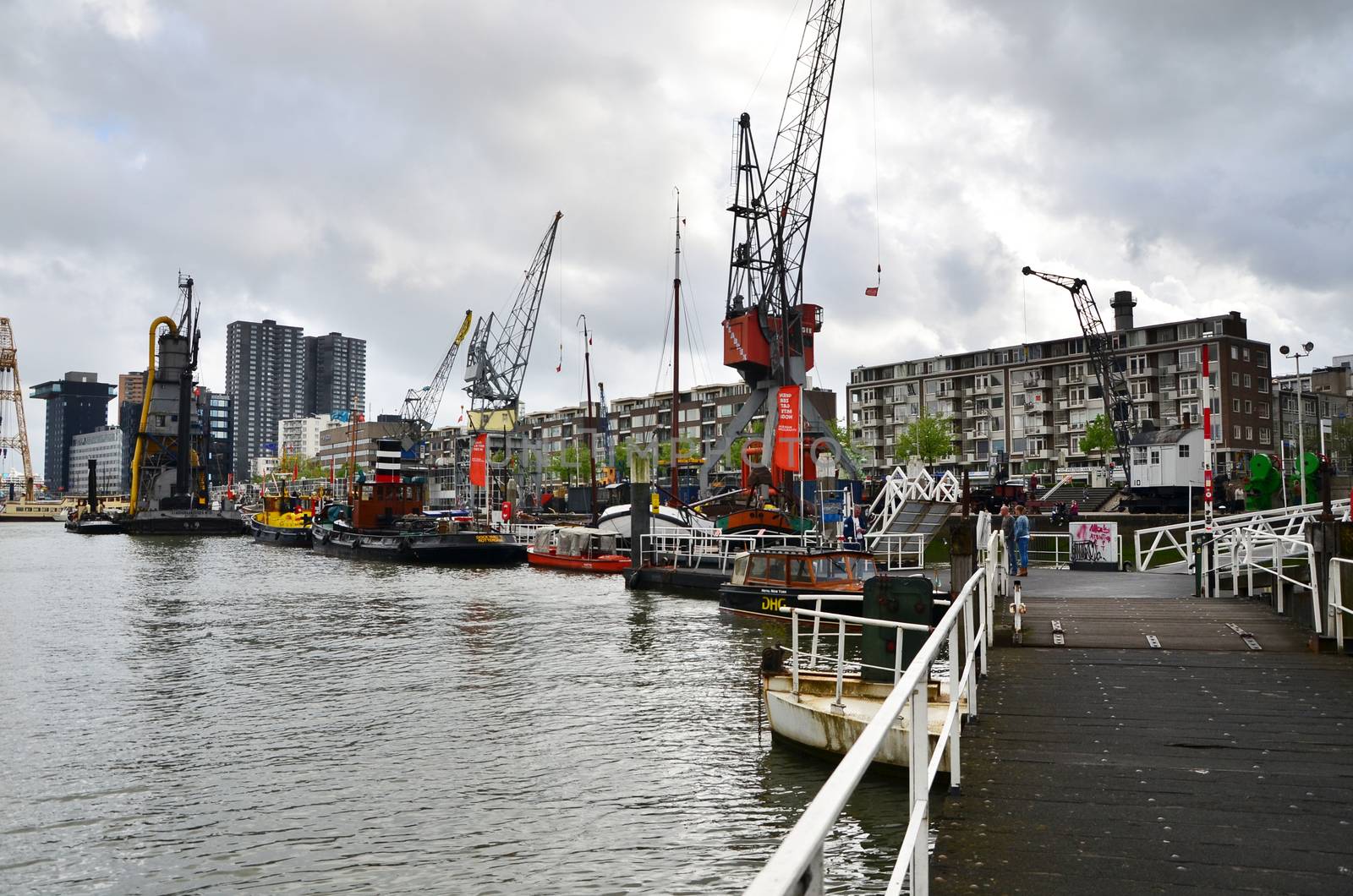 Rotterdam, Netherlands - May 9, 2015: People at Leuvehaven district in Rotterdam by siraanamwong