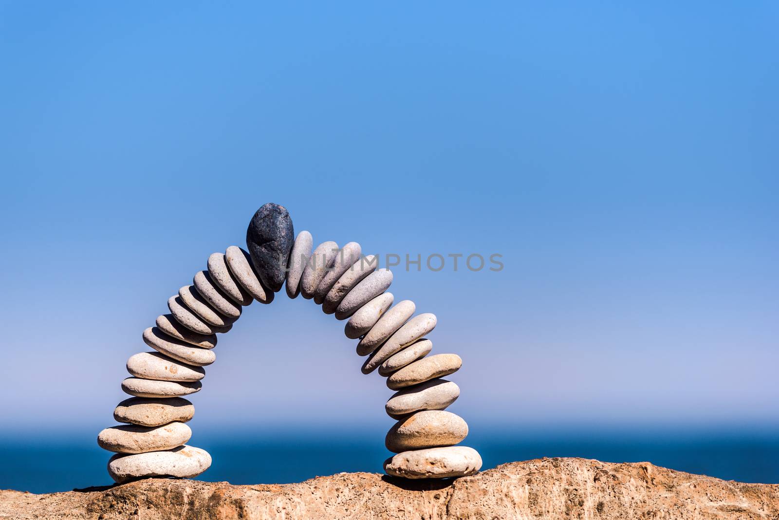 White arch of pebbles by styf22