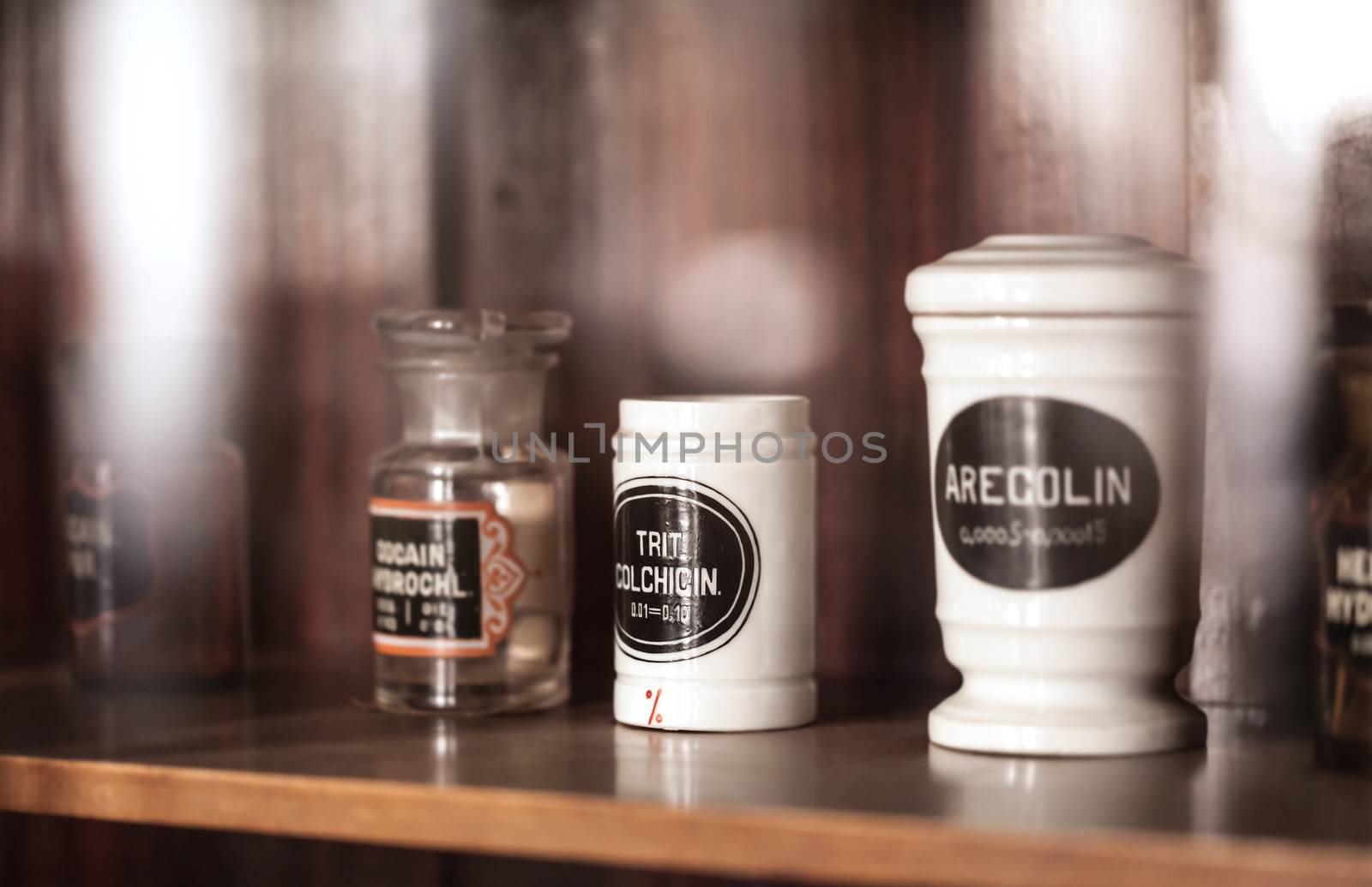 vintage medications in small bottles on a shelf