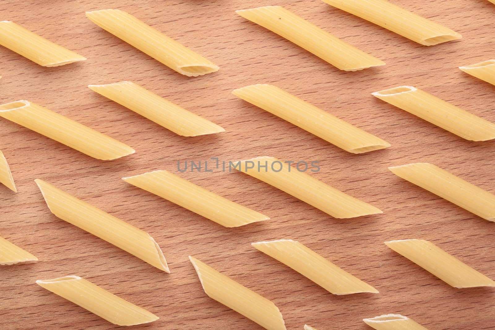 raw the pasta closeup on wooden background 