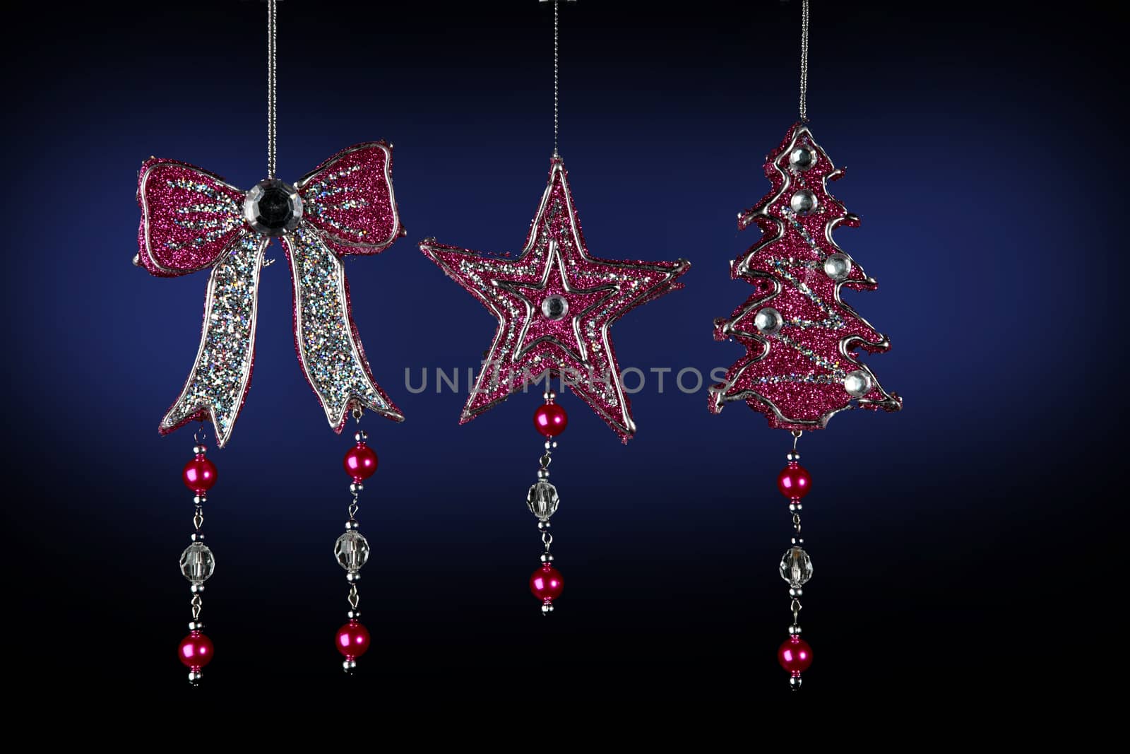 Christmas decorations to hang on the Christmas tree on a black and blue background