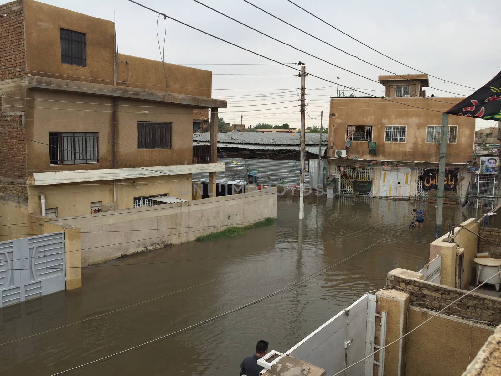 IRAQ, Baghdad: A street is flooded after heavy rainfall in the capital Baghdad, on October 29, 2015. Torrential rain caused chaos across several parts of Iraq, with the water causing thigh-high flooding on some Baghdad streets and damaging camps for the displaced.