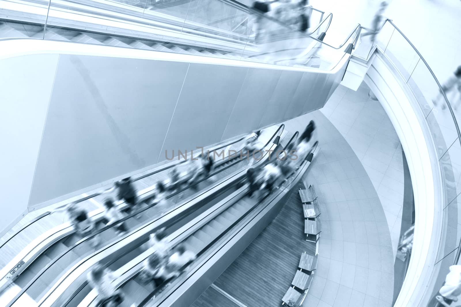 Modern shopping mall. Crowd of people on the escalator.