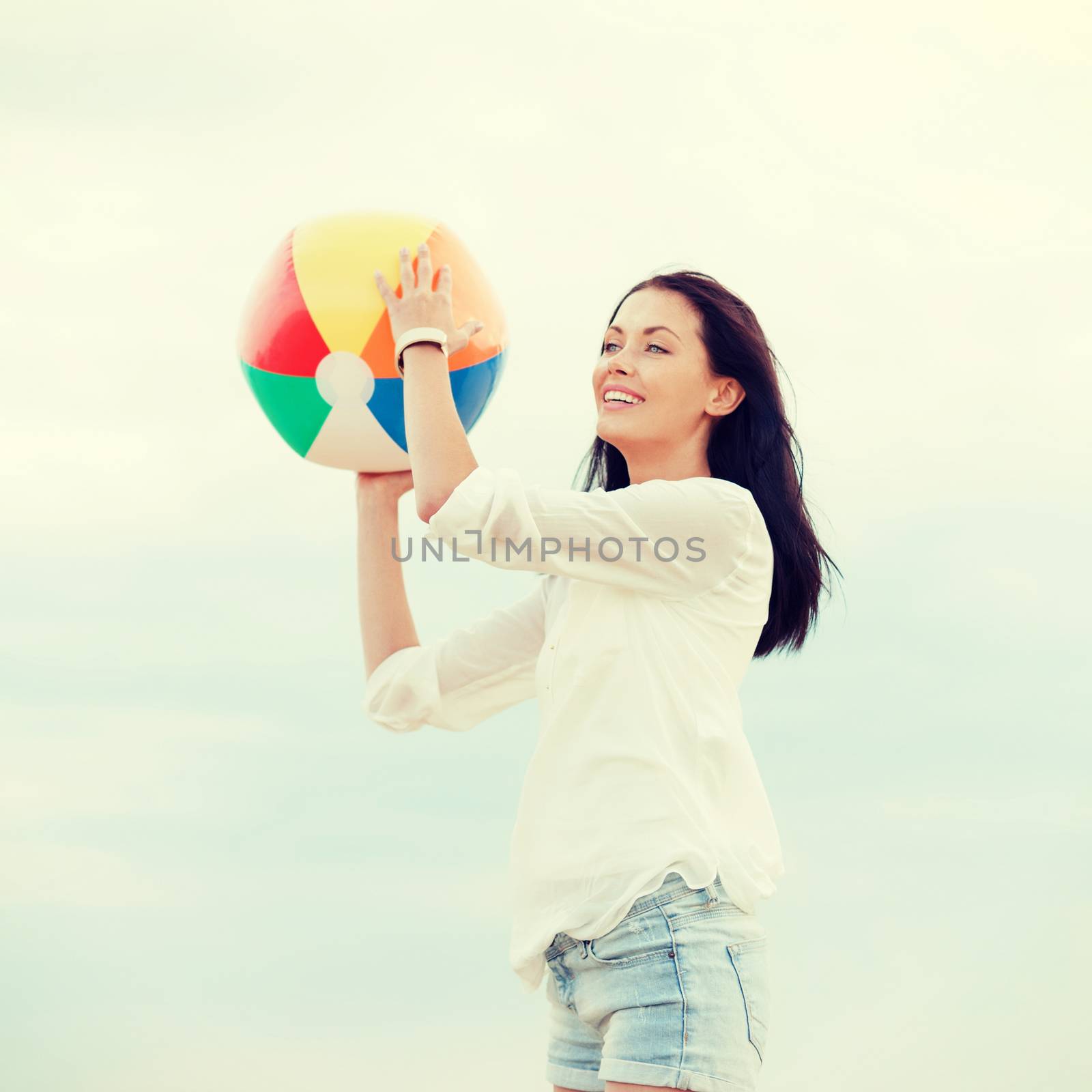 girl with ball on the beach by dolgachov