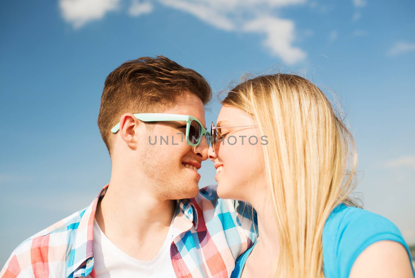 smiling couple having fun outdoors by dolgachov