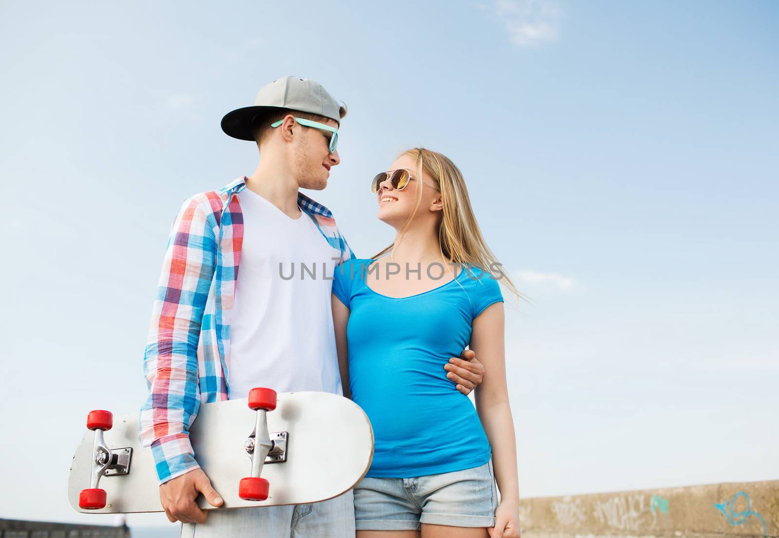 smiling couple having fun outdoors by dolgachov