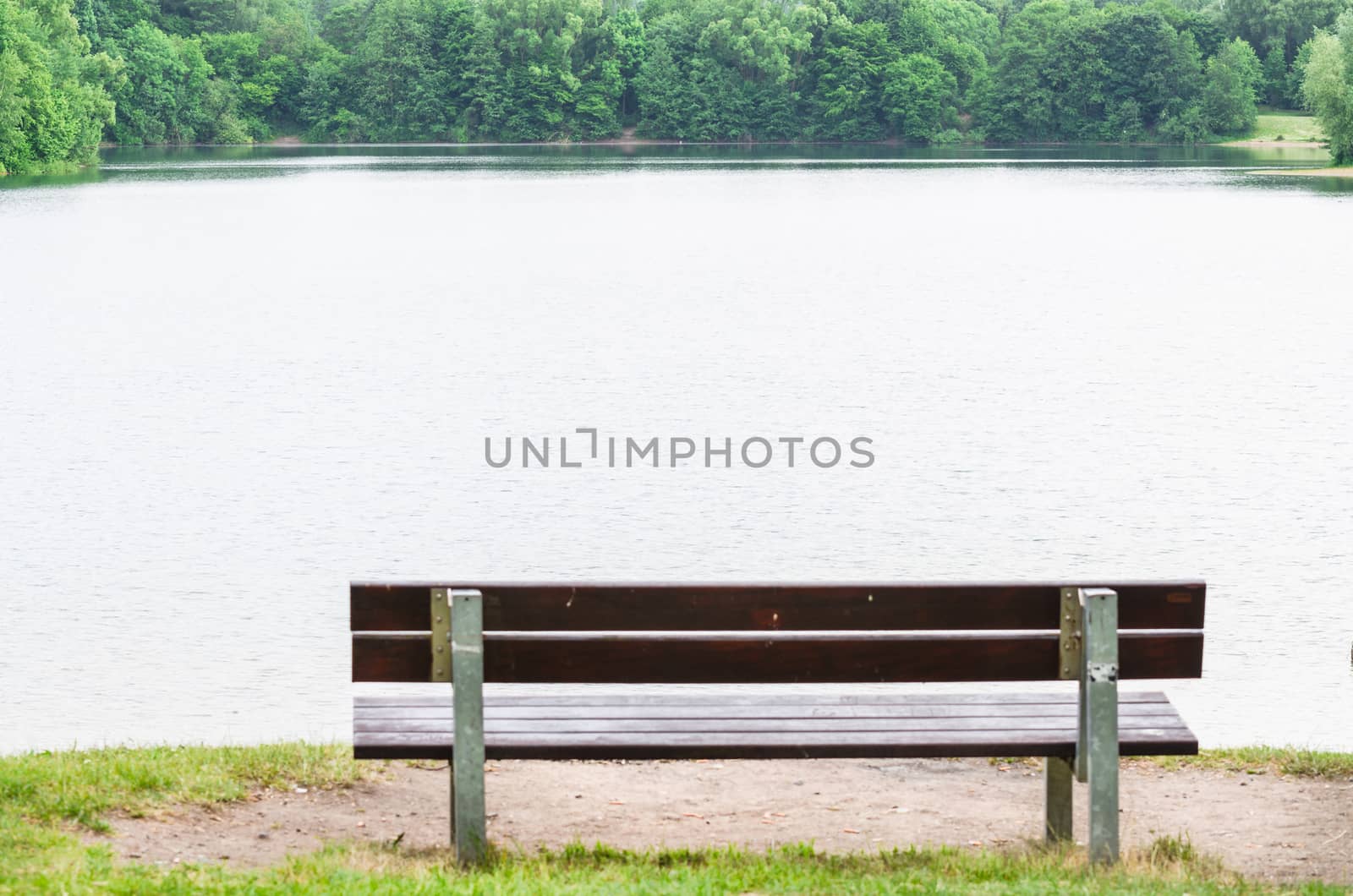 Old Wooden bench on a lake. Recording in Ratingen, Germany at the Green Lake.