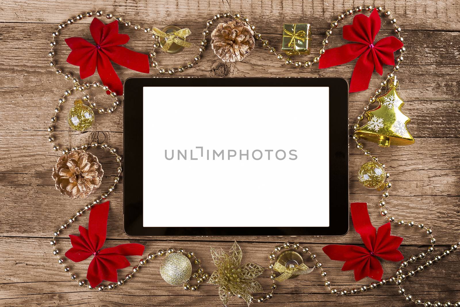 tablet pc with  christmas decorations by manaemedia