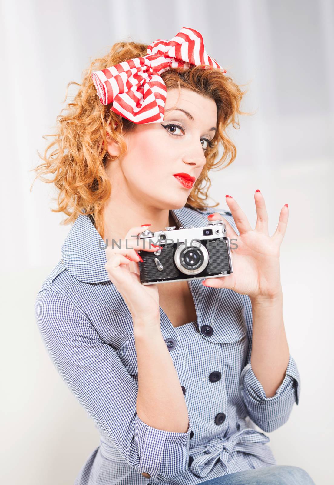 Portrait of elegant retro style woman/housewife with photo camera