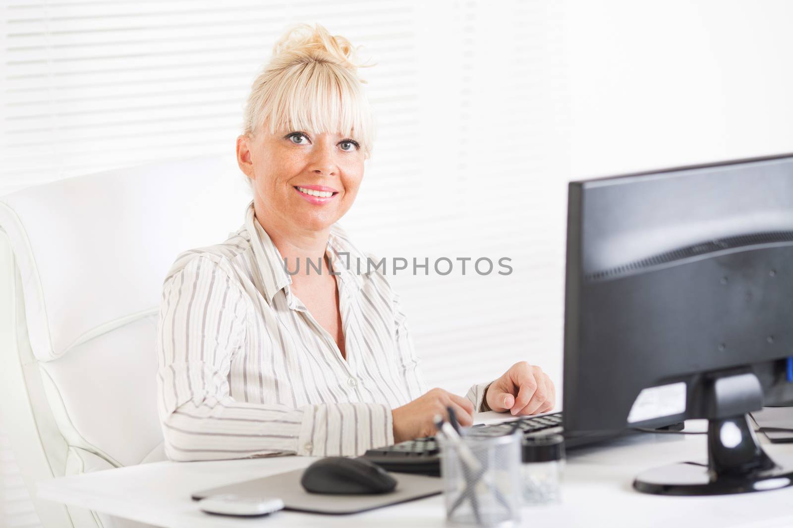 Beautiful mature Business woman working in the office