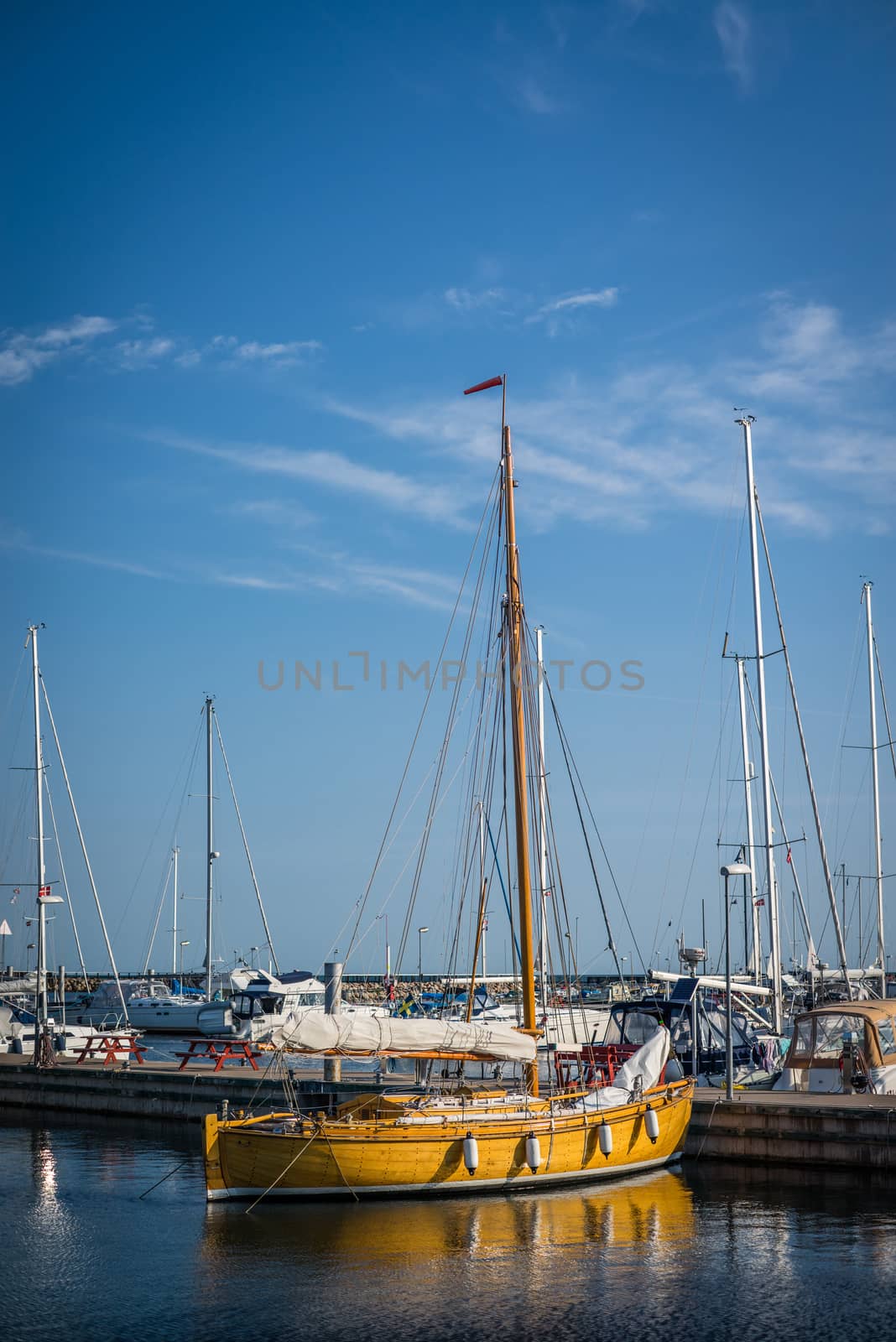 Sailboat in a marine harbor in the summertime