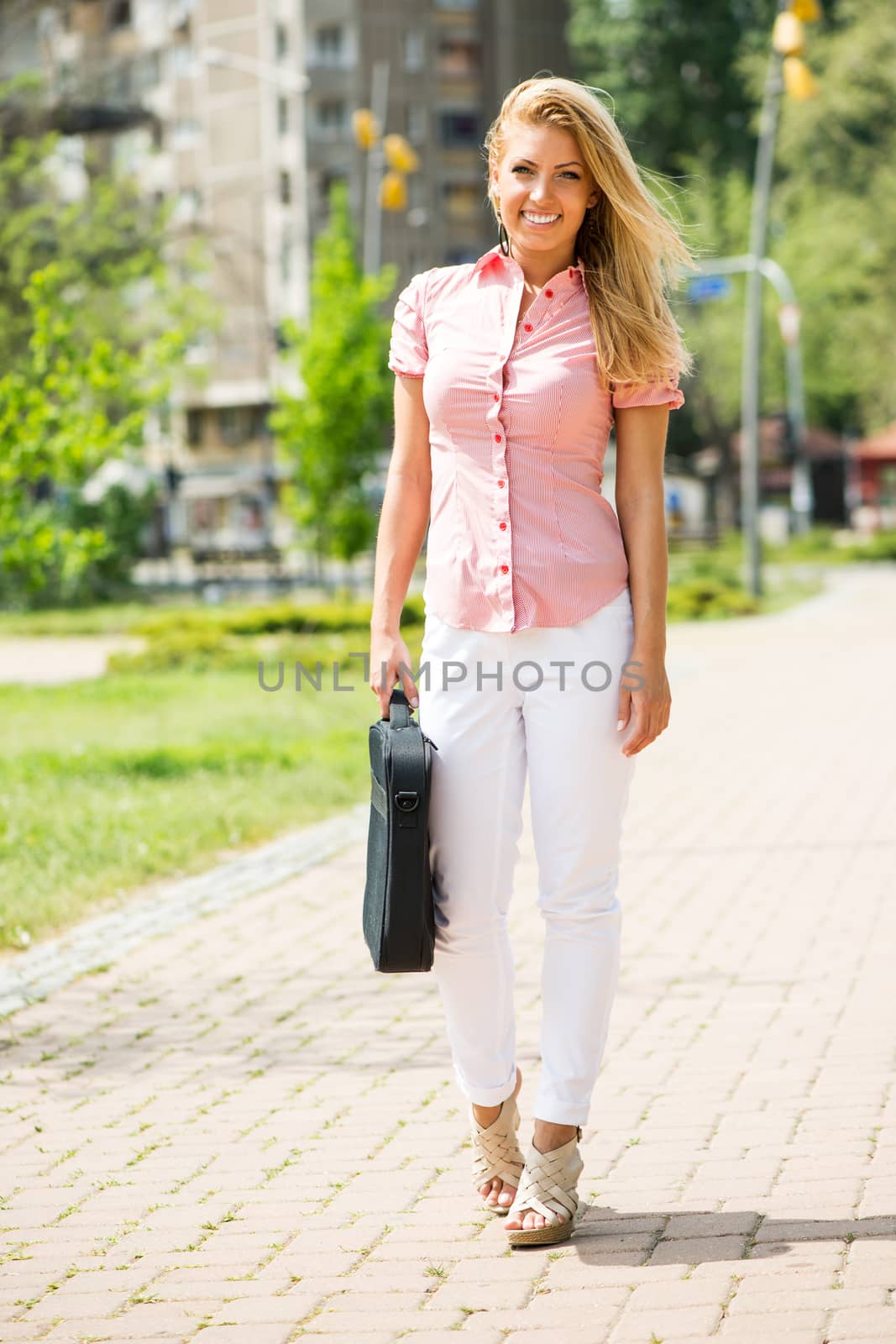 Smiling Business woman in the park by MilanMarkovic78