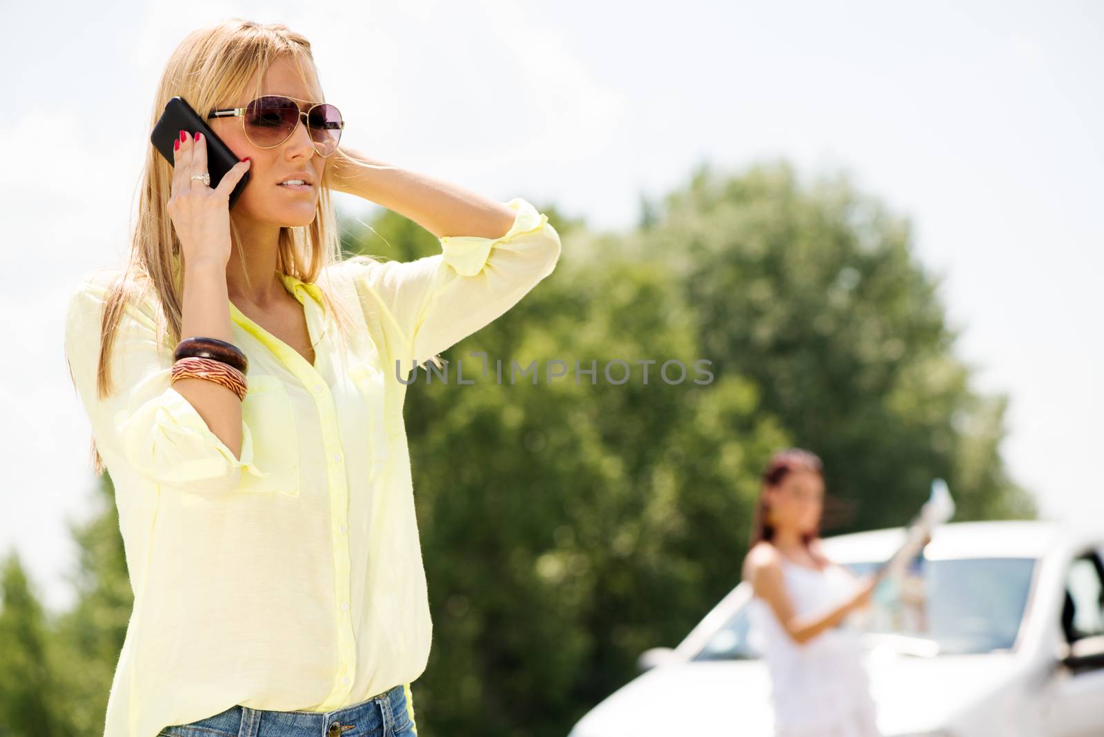 Young Tourist Woman Making Phone Call and asking for direction, because she is lost on the road.