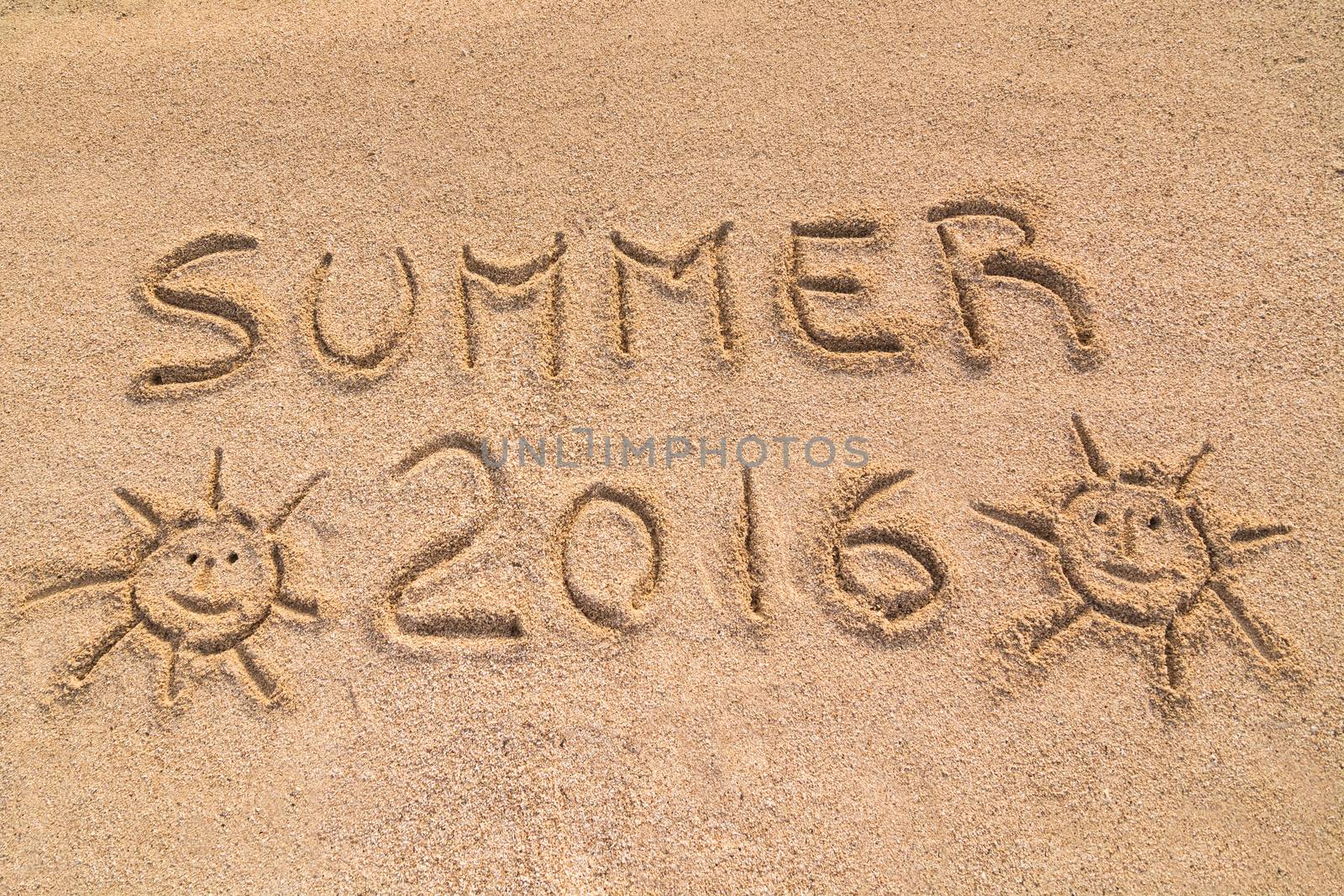 In the picture the words on the sand "Summer 2016".