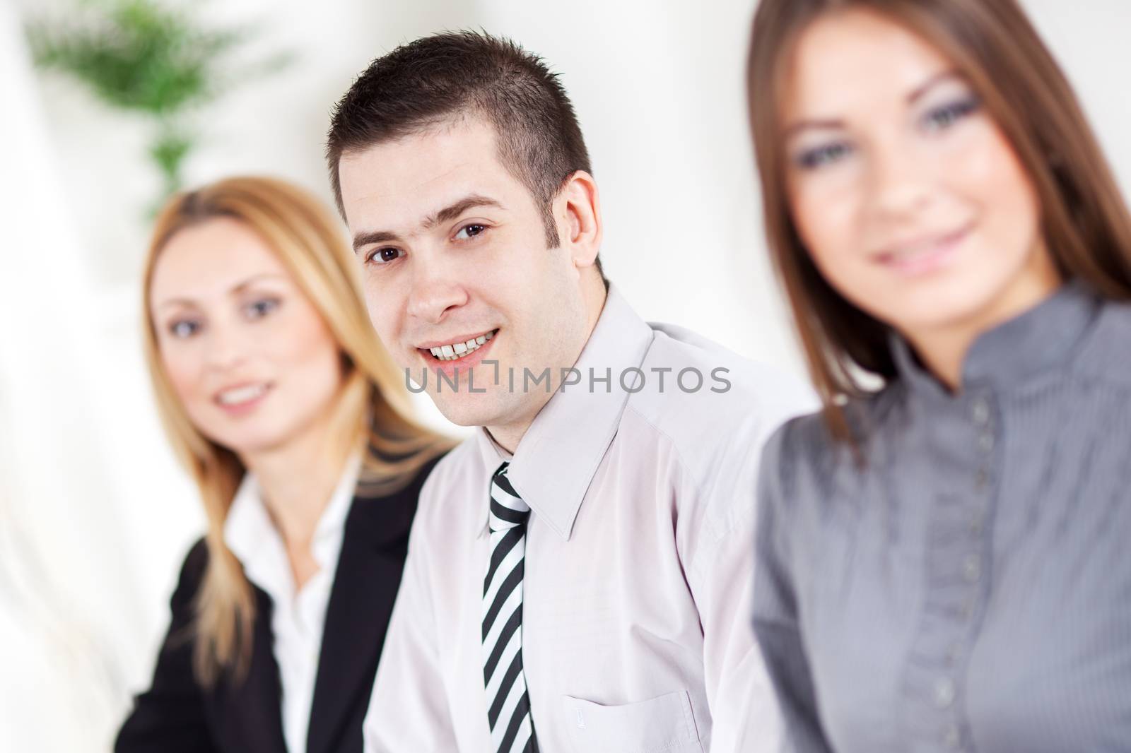 Happy young Businessman in the office, Looking at camera.