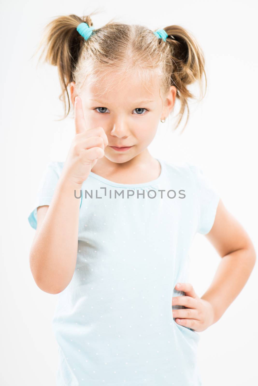 Cute little girl giving a warning sign scolding.