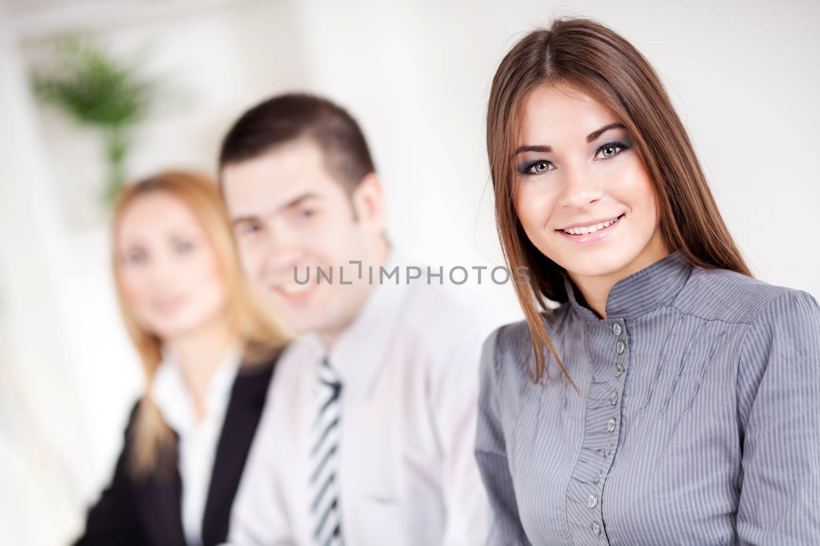 Happy young Businesswoman in the office, Looking at camera.